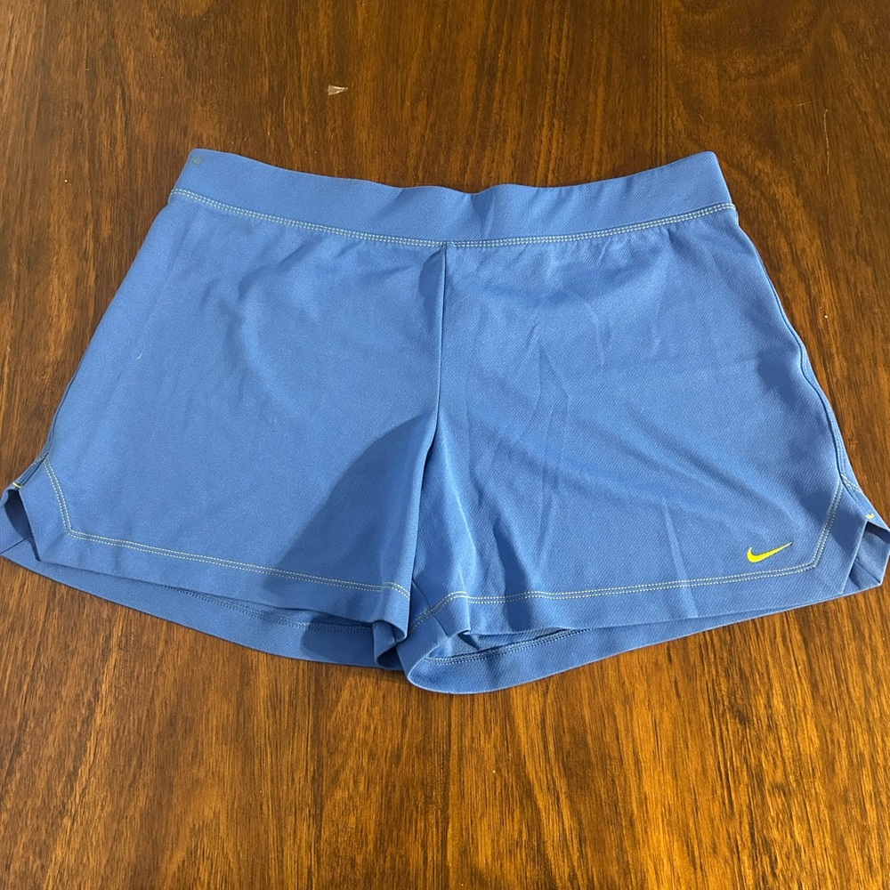 Nike Women's Blue Athletic Shorts with Yellow Swoosh